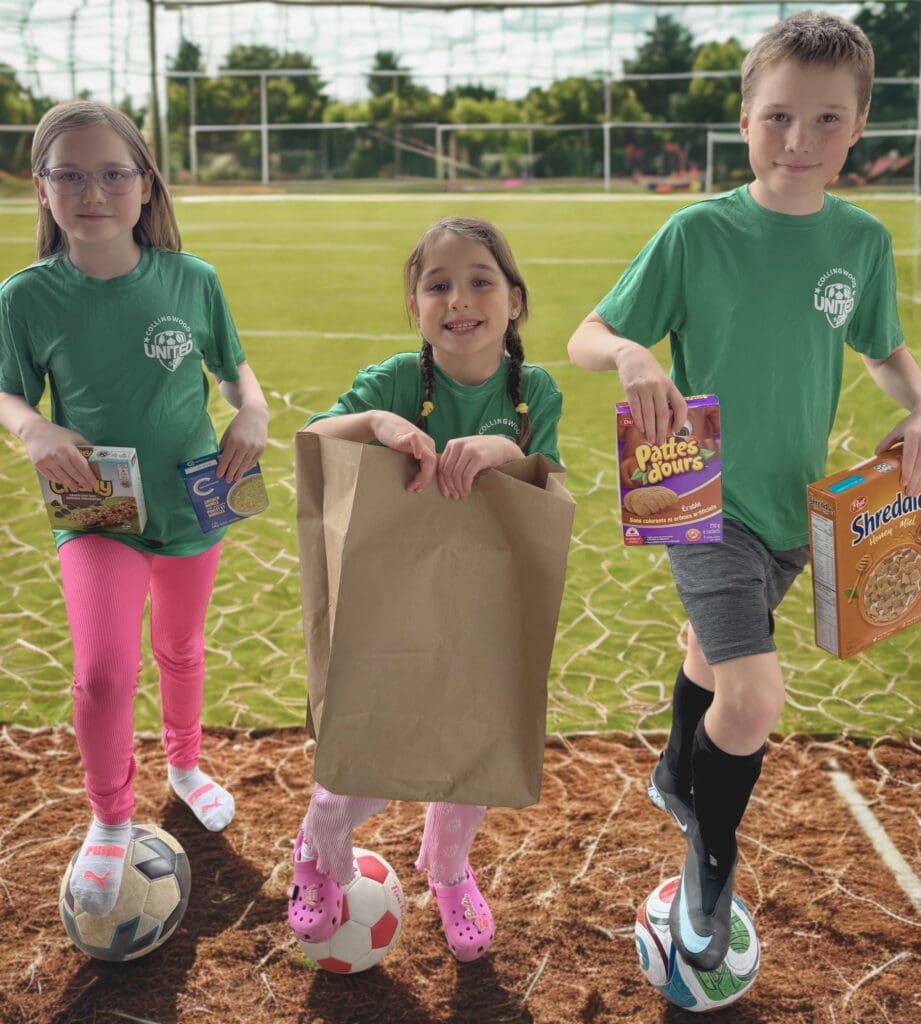 Three Children with Food on Soccer Field (1)